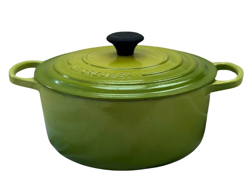 Le Creuset 5.5 qt round dutch oven with lid in palm