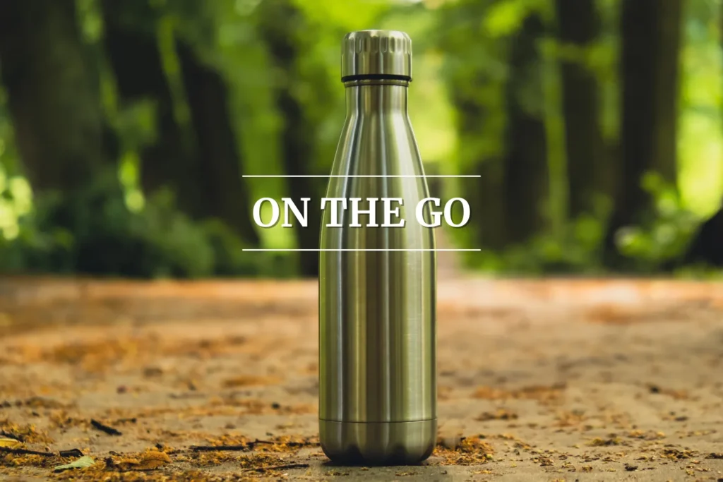 Stainless steel reusable water bottle standing outdoors, symbolizing on-the-go gifts for college students.