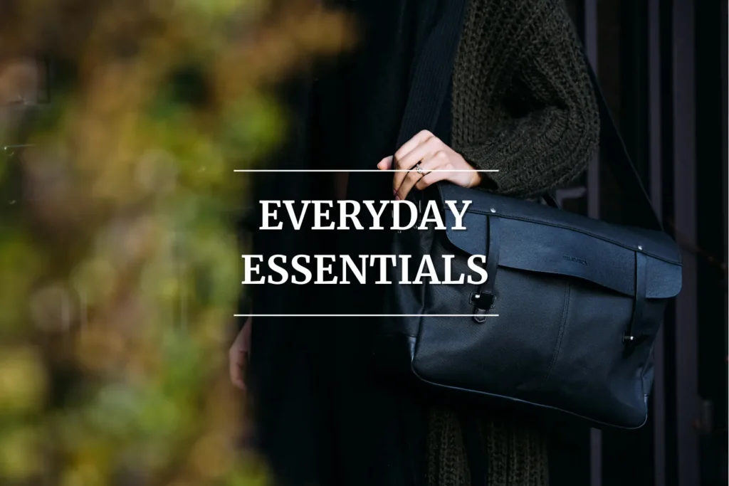 College student carrying a sleek black messenger bag, representing everyday essentials for campus life.