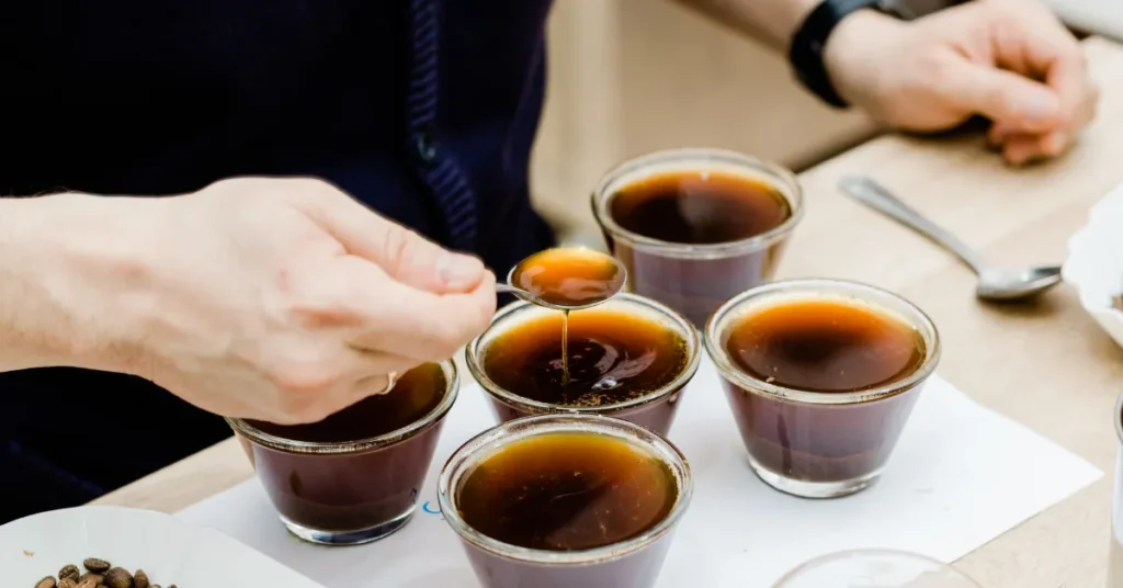 breville luxe brewer coffee tasting setup with multiple cups and spoon testing extraction