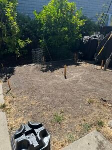 A blank slate to build a beautiful deck with a greenhouse on top of it all while rat proofing