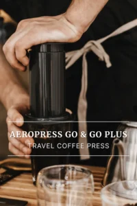AeroPress Go travel coffee maker — hand pressing at counter