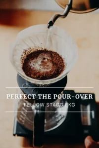 Fresh coffee brewing in a pour-over dripper on a digital scale with the Fellow Stagg EKG kettle.
