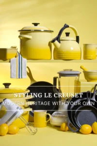 Yellow enamel cookware styled with lemons, mugs, glassware, and a hand mixer. A mix of Dutch ovens, skillets, and accessories arranged against a yellow background, showing how Modern Heritage pieces can be styled with an eclectic kitchen collection.